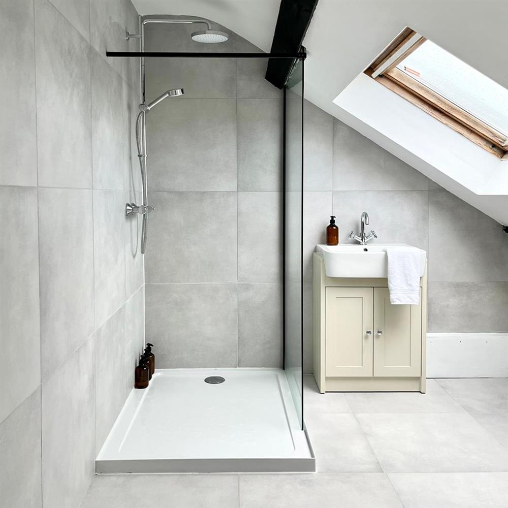 Lavo SIlver concrete effect porcelain tiles in an angular bathroom